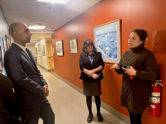 EOVS Secretary Jon Santiago speaks with staff during a visit to the New England Center and Home for Veterans (NECHV).