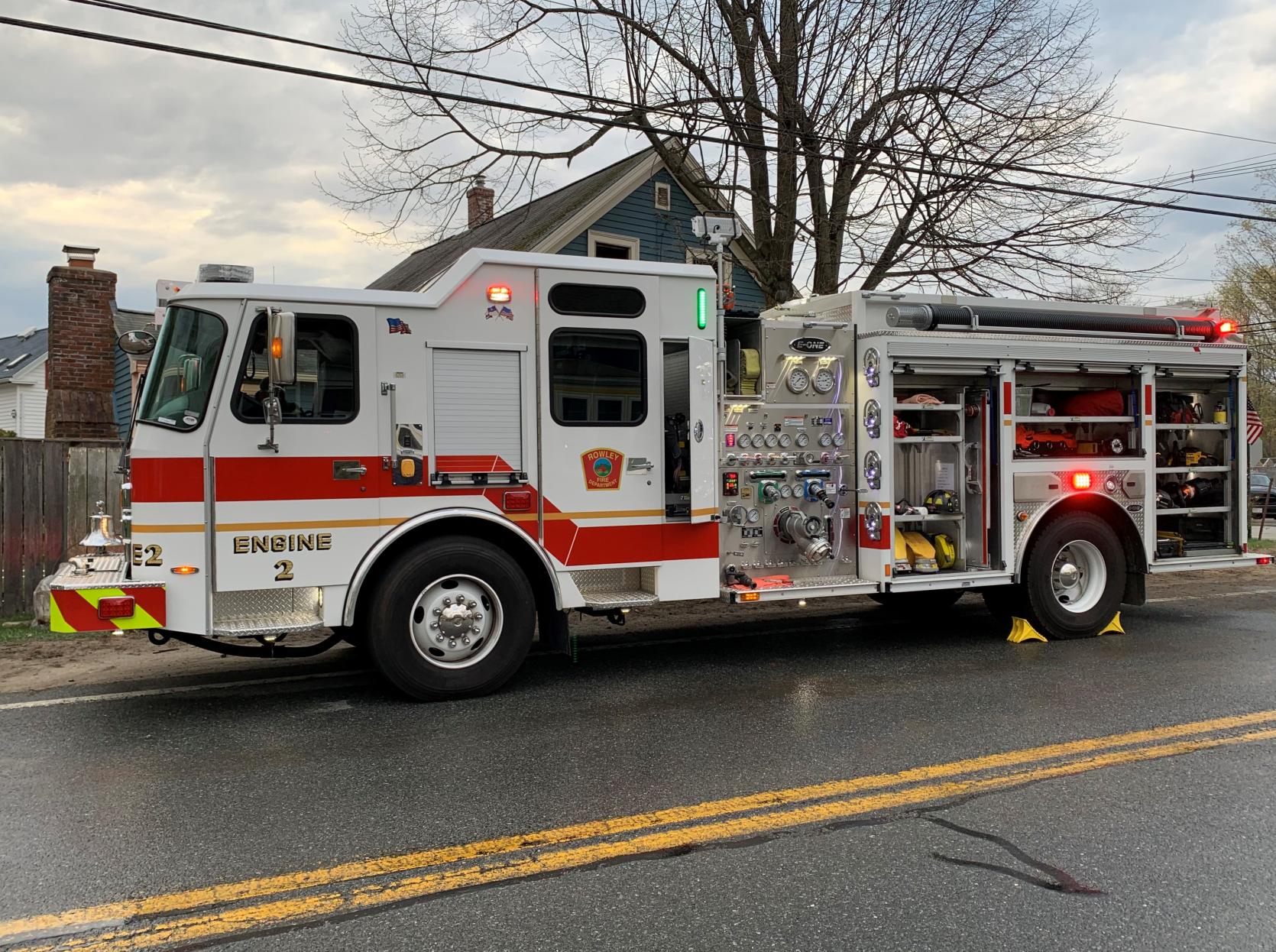 Picture of a fire engine in front of a house