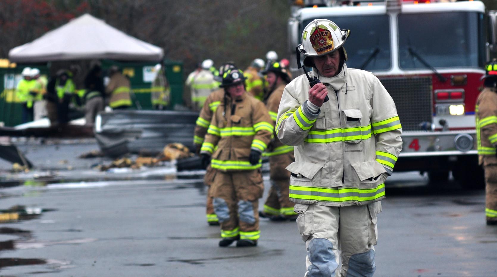 Picture of a fire chief speaking into a radio