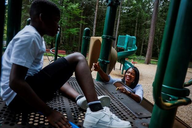 Cynthia Laine tried to encourage her son Luke, 11, to go down the slide while visiting Coggshall Park in Fitchburg.ERIN CLARK/GLOBE STAFF