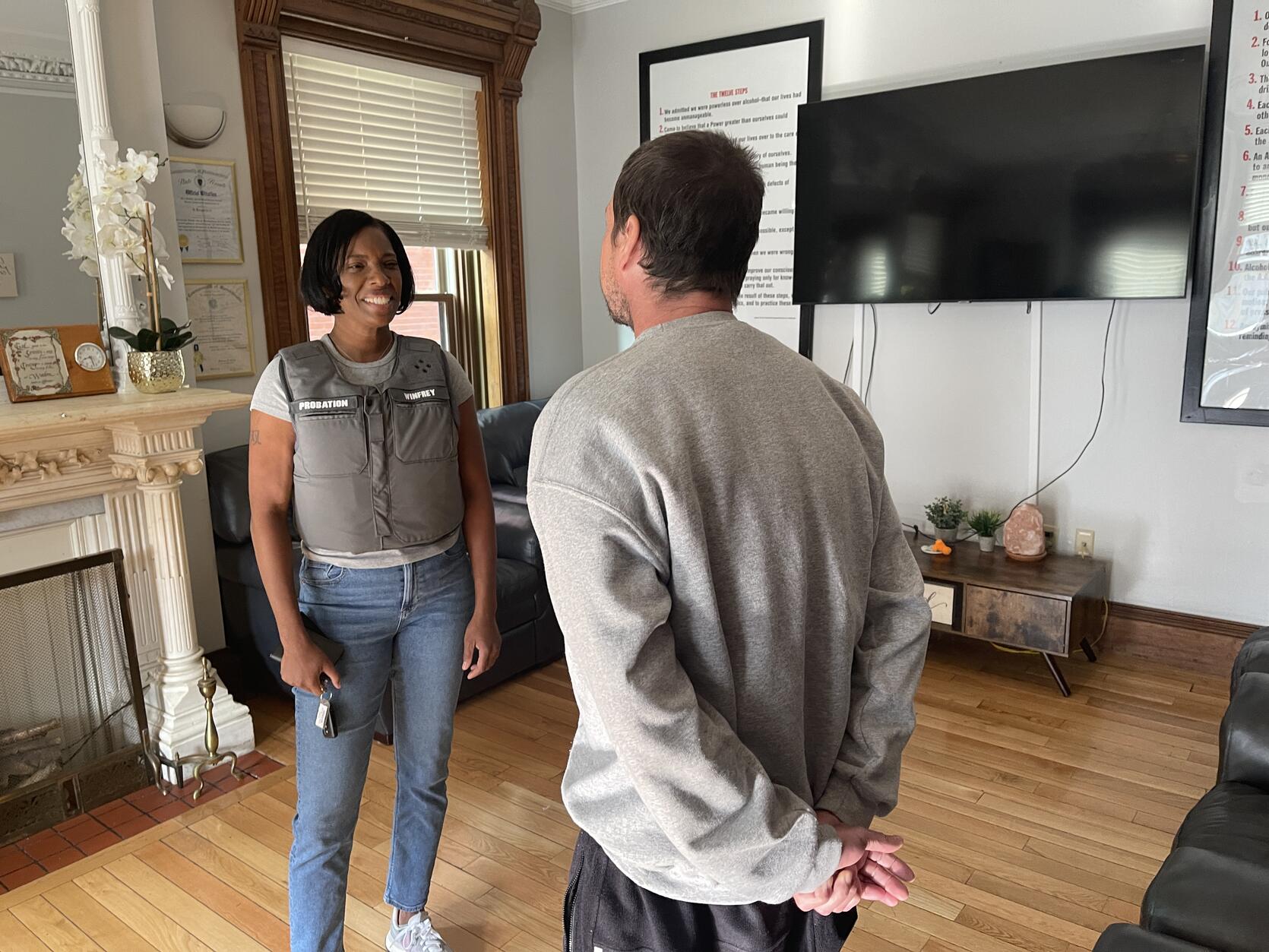 Suffolk Superior Court Probation Officer Ellen Winfrey (left) meets with a probationer in East Boston. 