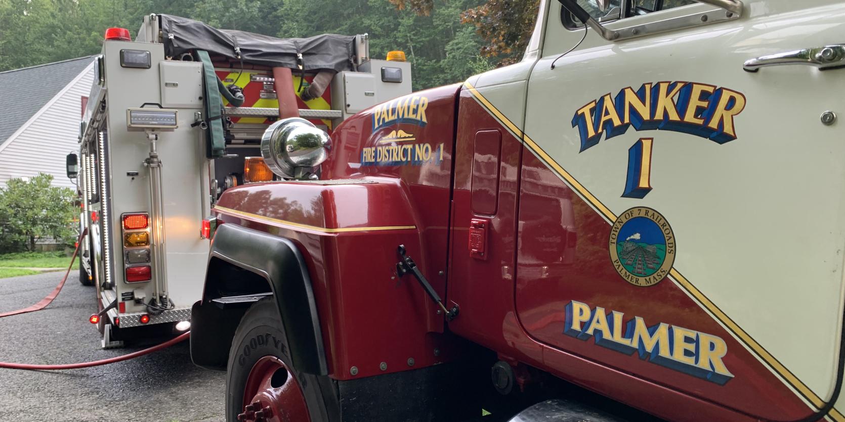 A photo of a fire engine with the words "Tanker 1 Palmer"