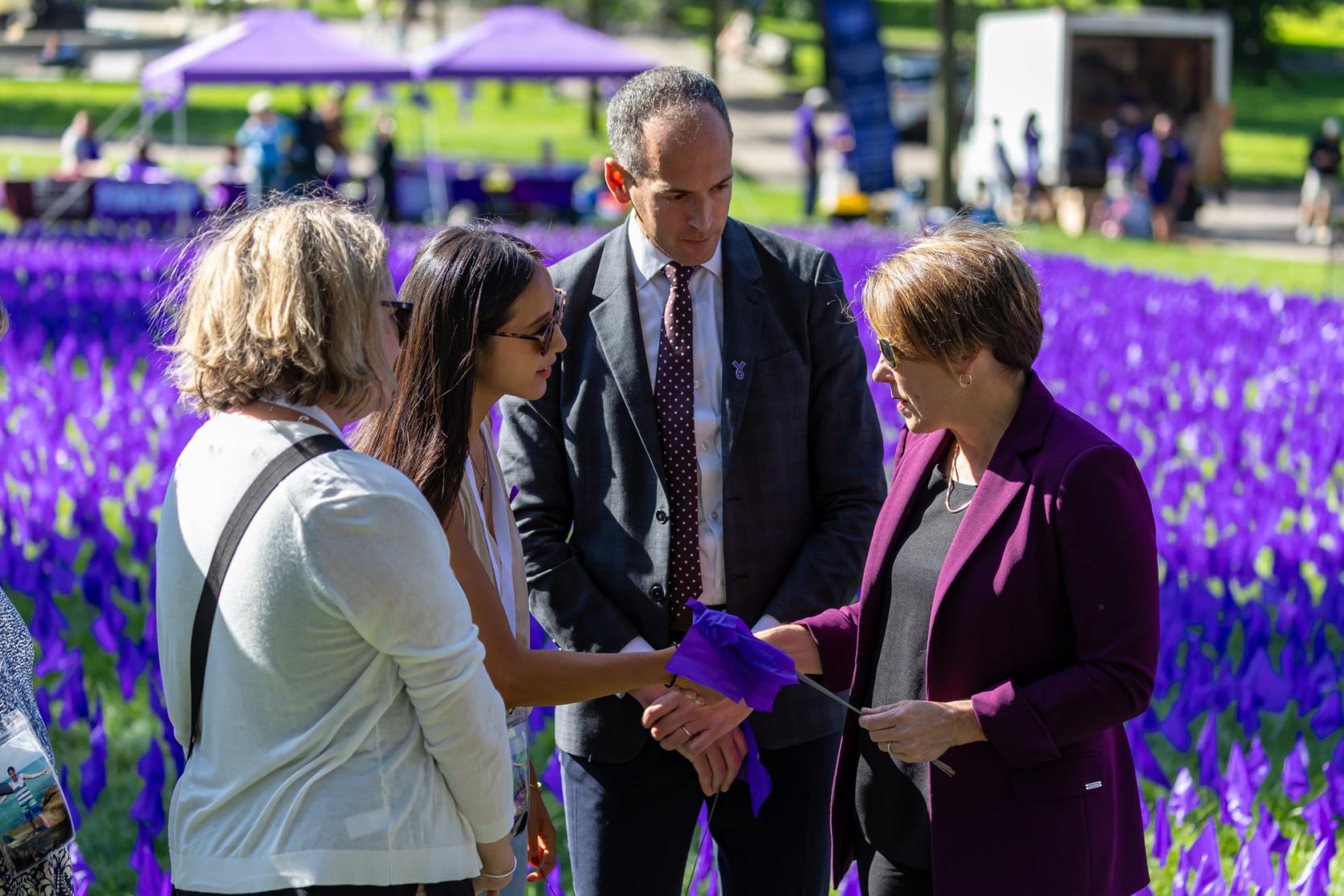 Governor Maura T. Healey and Department of Public Health Commissioner Robbie Goldstein, MD, PhD speak with Kar-Kate Parenteau and Cindy Kucich who lost their husband and brother, respectively, to overdose.