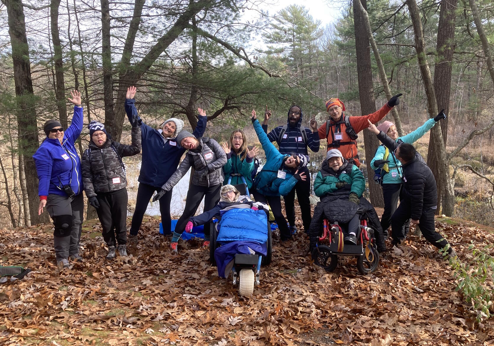 A group of hikers posing with silly faces.