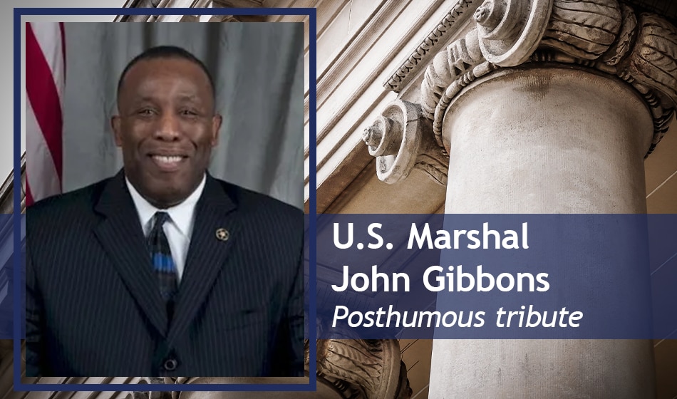 Headshot of U.S. Marshal John Gibbons on a background of court pillars. Text reads: U.S. Marshal John Gibbons, posthumous tribute. 