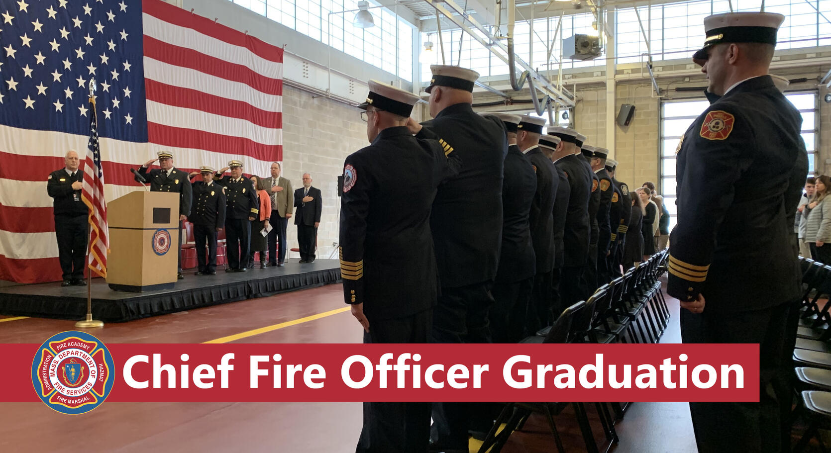 Photo of uniformed fire chiefs saluting the US flag