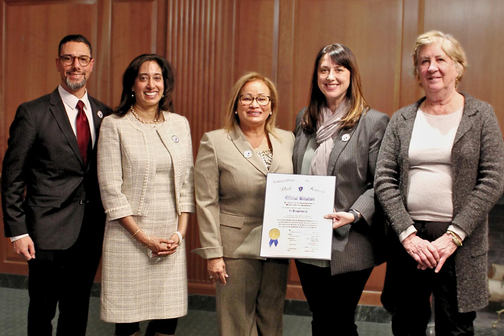 From left to right: MCAD Interim Executive Director, MCAD Chairwoman, MCAD Commissioner, State Senator Robyn Kennedy, and State Representative Mary Keefe with a Citation for the office grand opening.