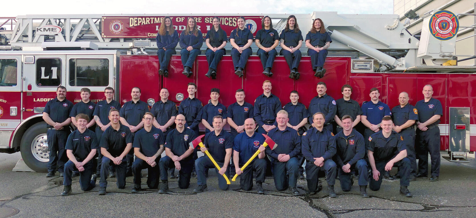 32 firefighters on and around a ladder truck