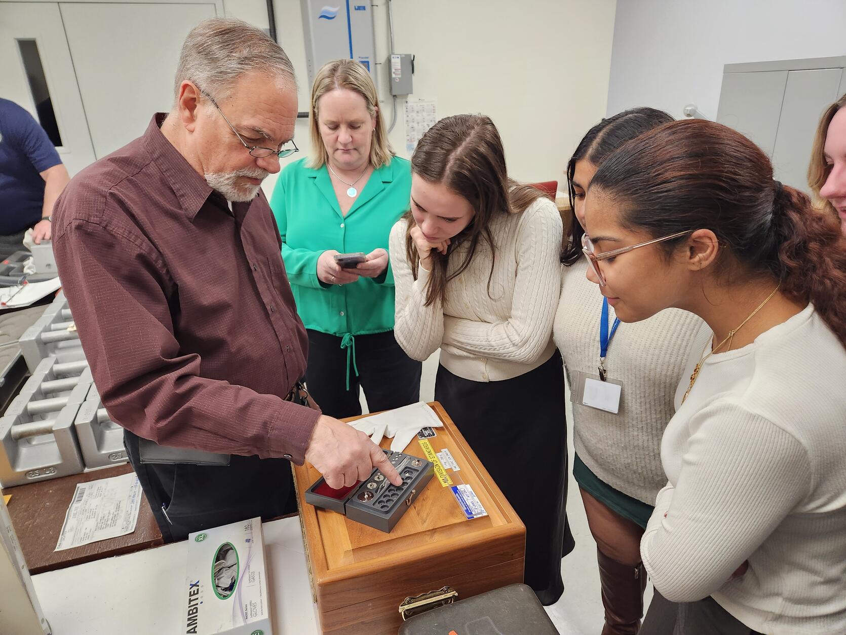 Student co-ops viewing an equipment demonstration at the Metrology Lab