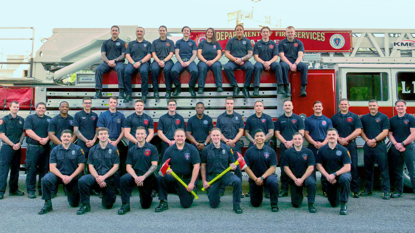 31 firefighters on and around a ladder truck