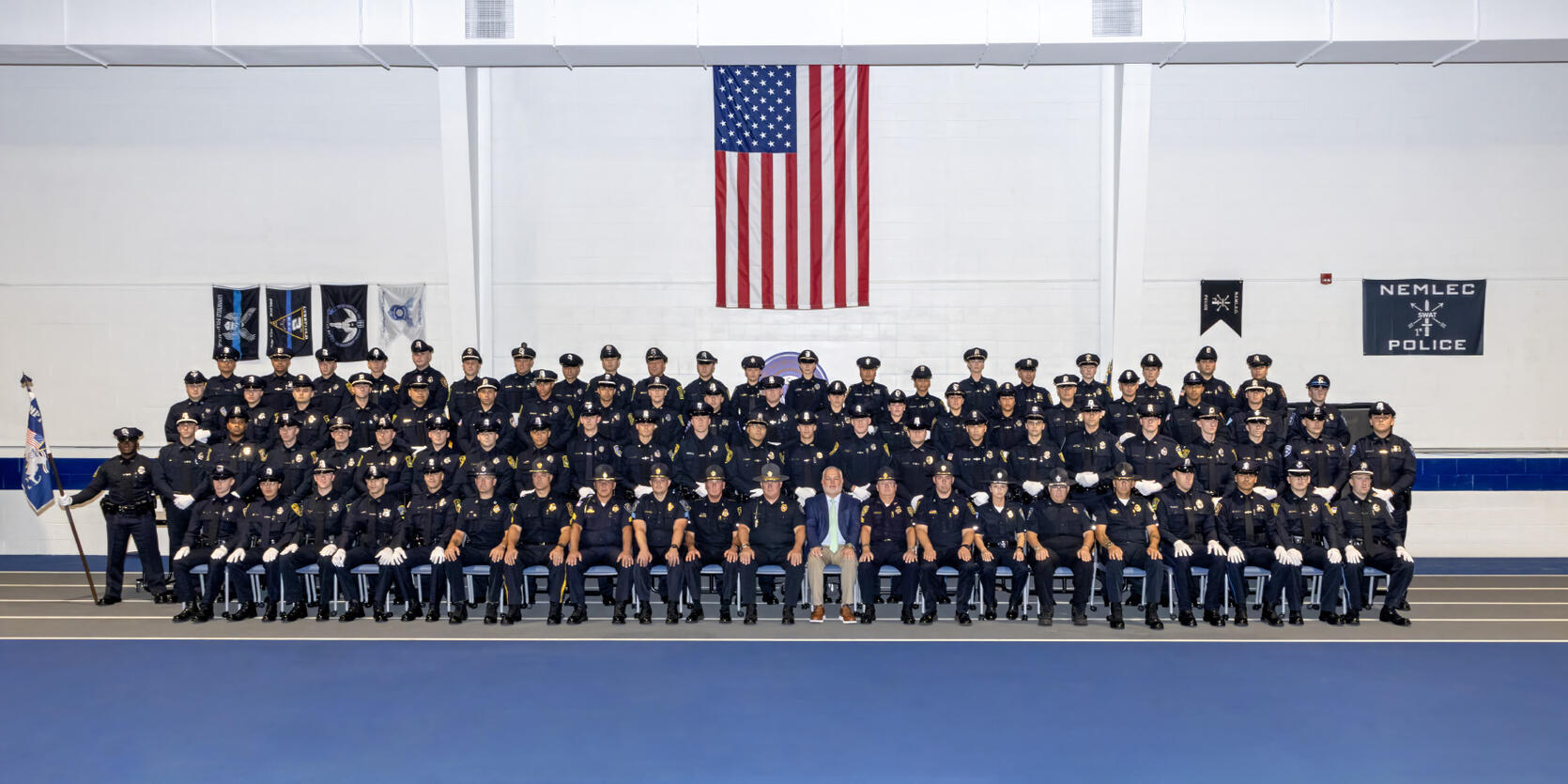 Local Police Officers Pose for Graduation Photo from the MPTC Police Academy