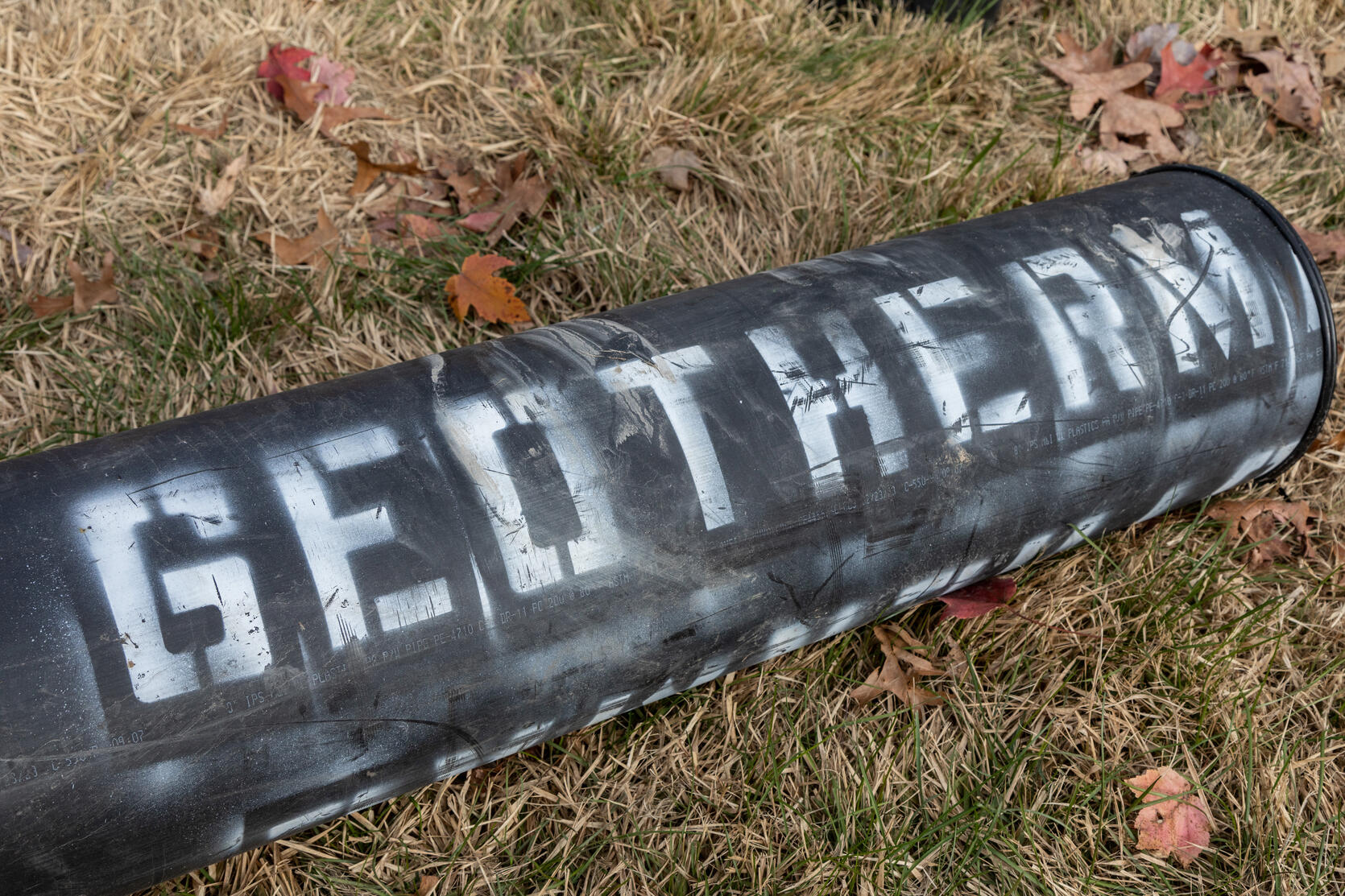 geothermal pipe laying on grass