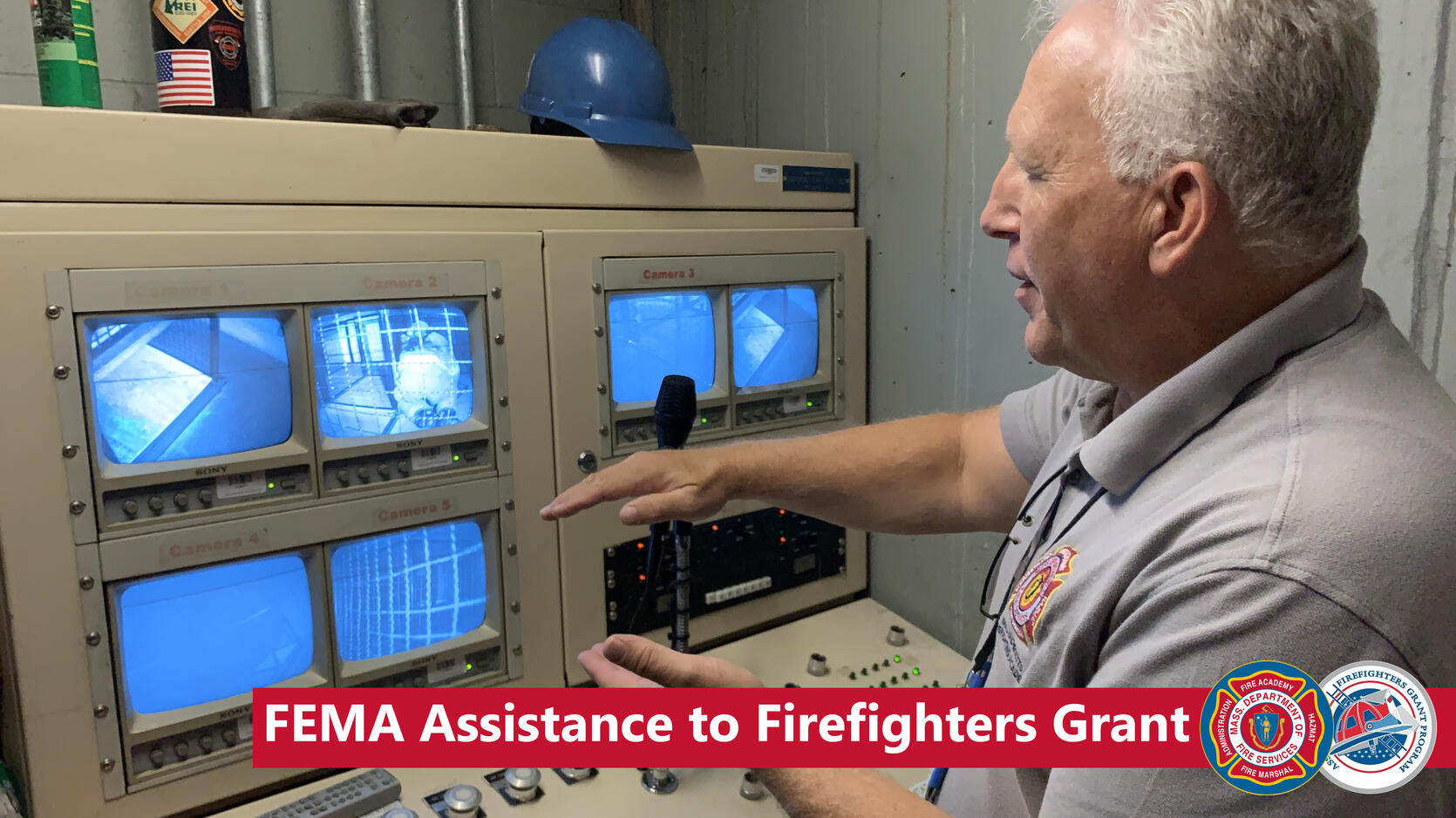 Instructor watches recruit firefighters training in a maze