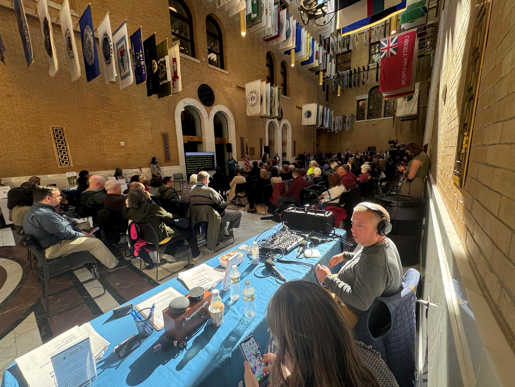 People gathered inside the Great Hall of Flags at the Massachusetts State House for White Cane Awareness Day on October 18, 2024.