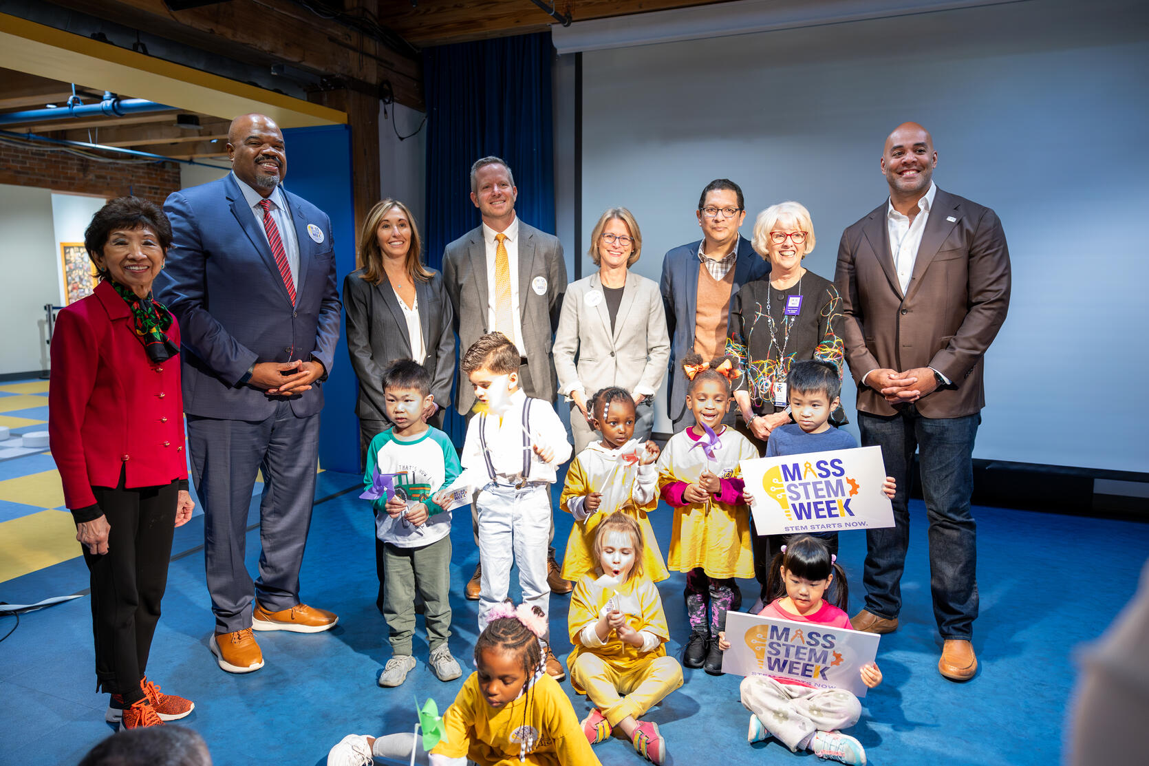 Members of the Healey-Driscoll Administration take a photo with preschoolers and the Boston Children's Museum.
