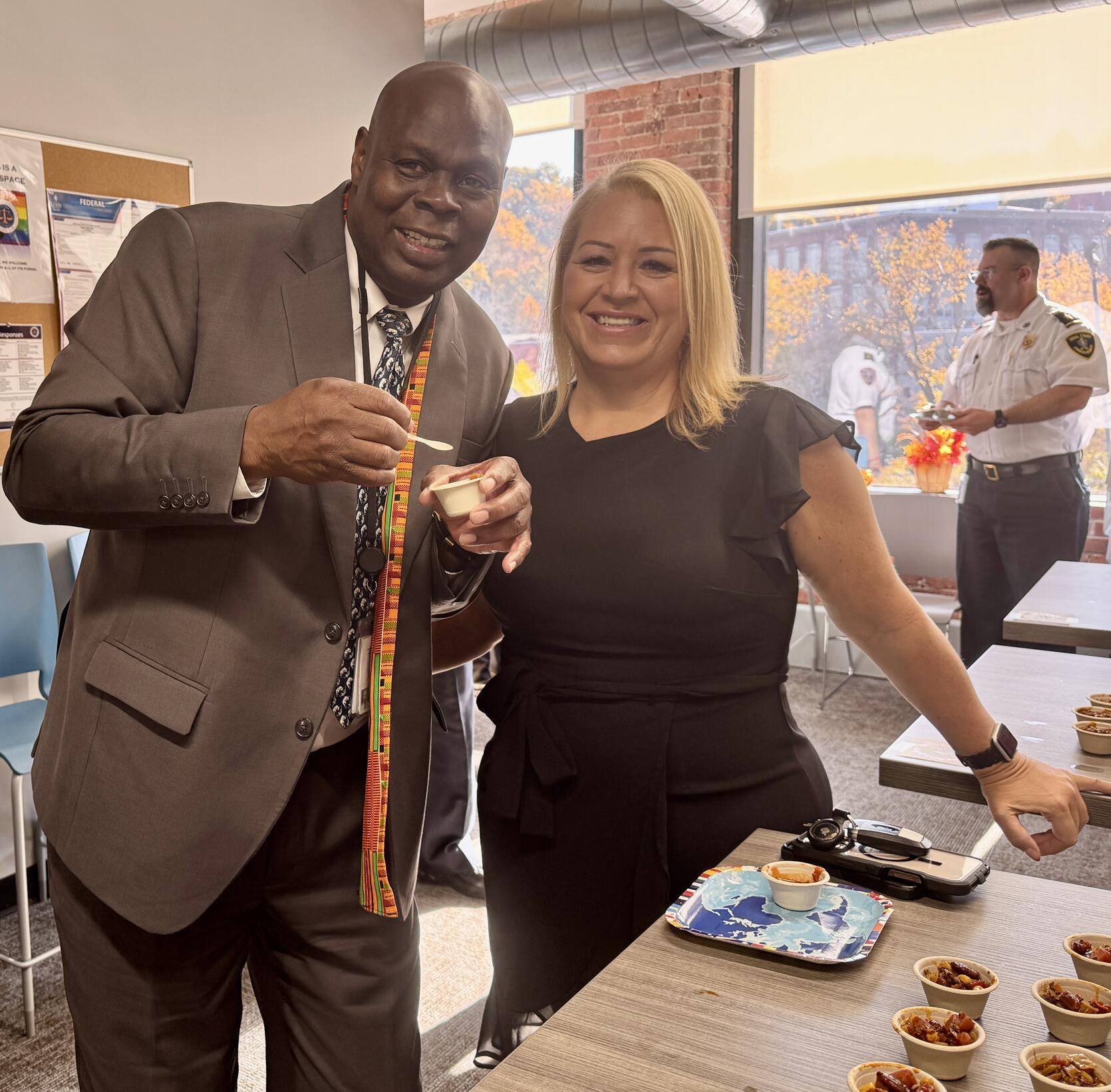 Commissioner Pamerson Ifill and Training Unit Administrative Coordinator Julie Grady try out chili