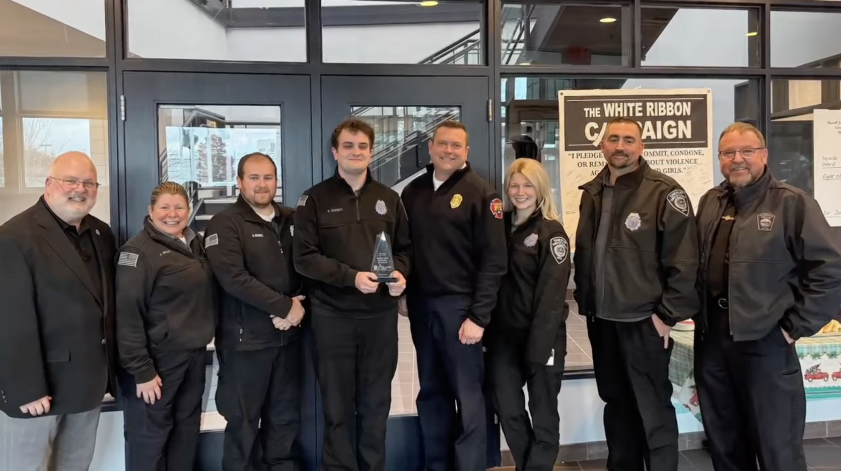 Plymouth 911 Communication Center staff pose with their award