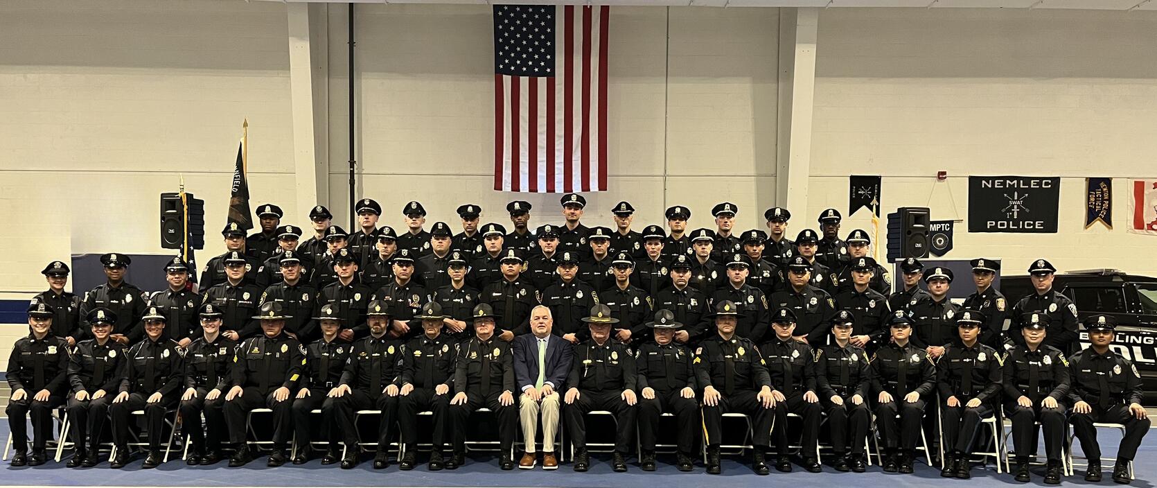 Police Officers pose for a graduation photo