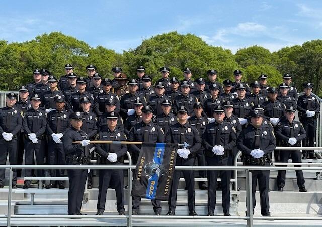 Police Officers pose for graduation picture