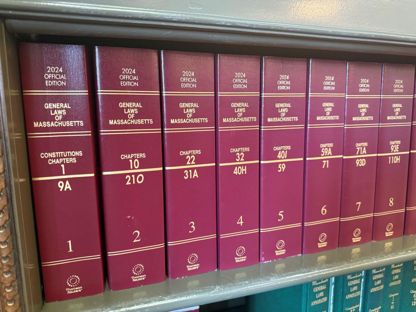 2024 Official Edition of the Massachusetts General Laws on a shelf