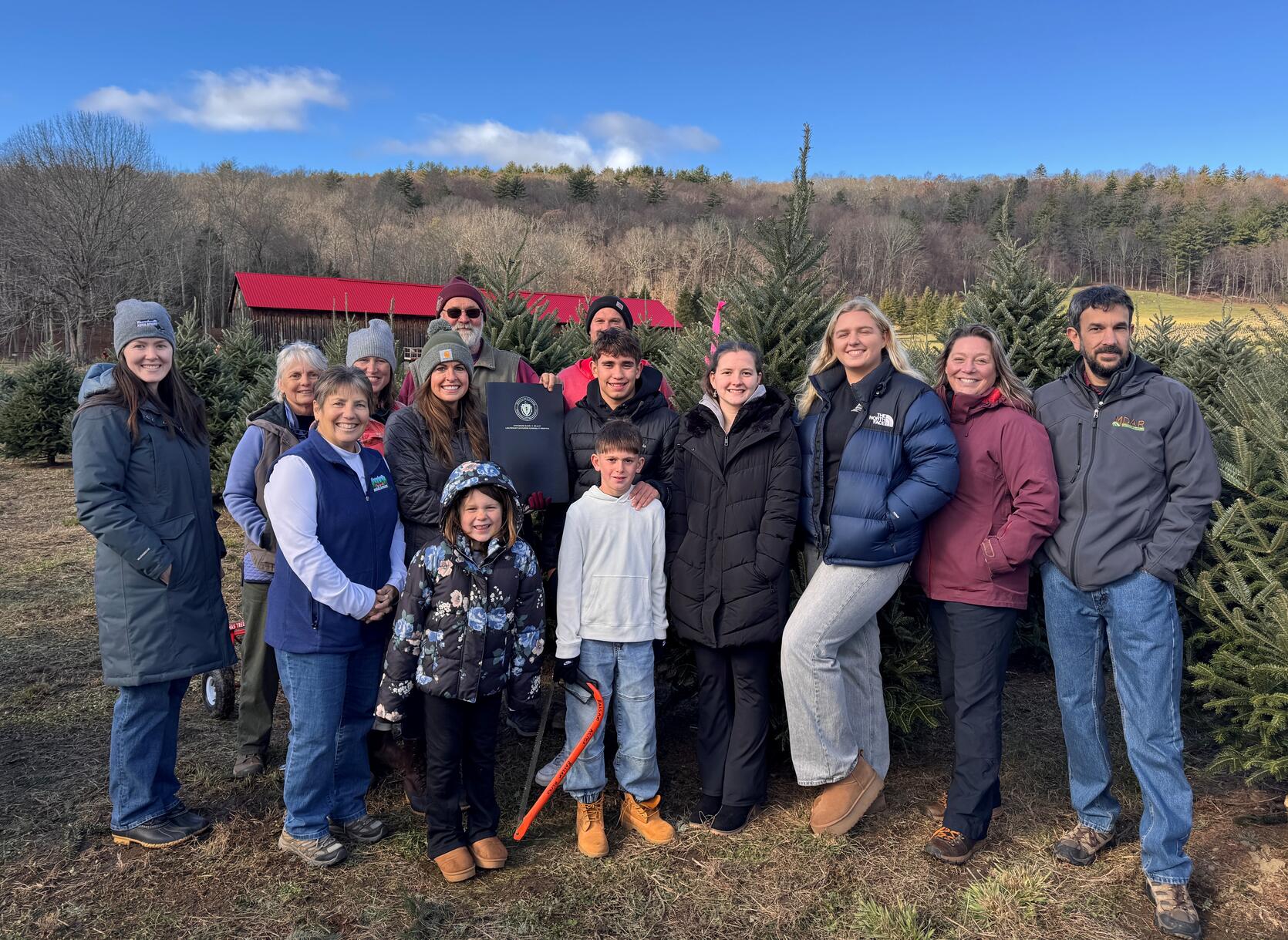 Commissioner Randle with MDAR staff, state and local officials, and the family of Bob Schrader, co-owner of Chestnut Mountain Christmas Tree Farm