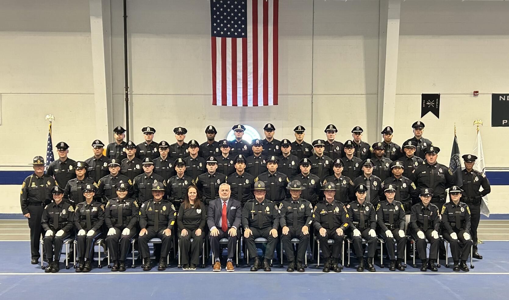 Police Officers pose for a graduation photo