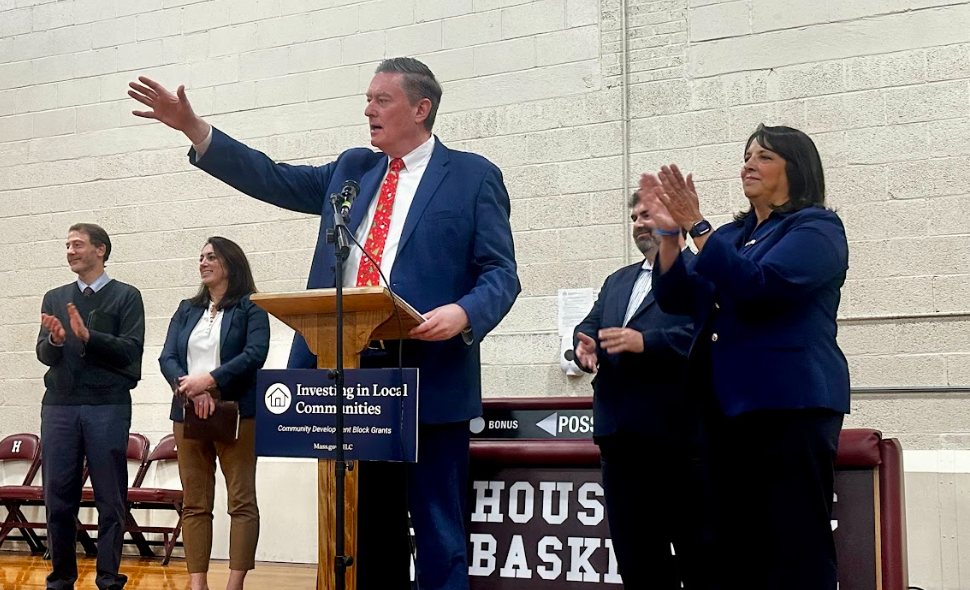 Secretary Augustus speaks from a podium in Great Barrington