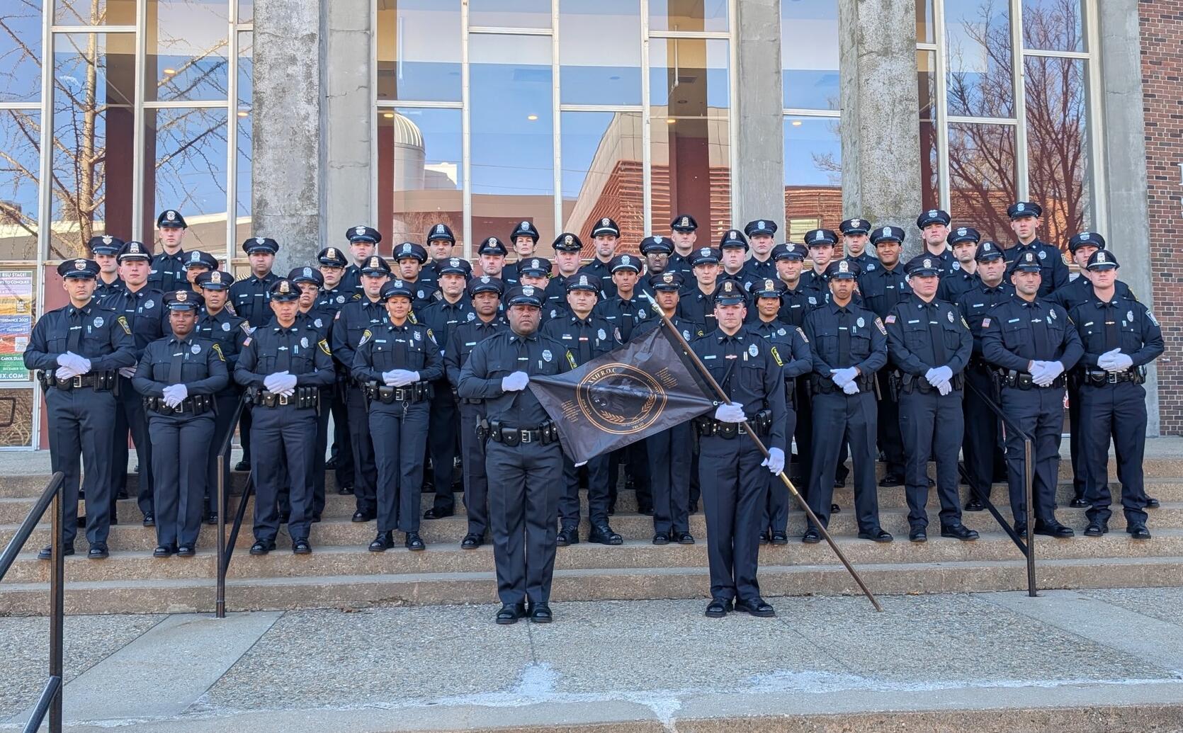 Police Officers pose for a graduation photo