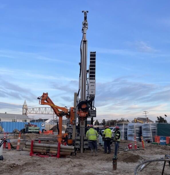 workers at ground source heat pump, MMA