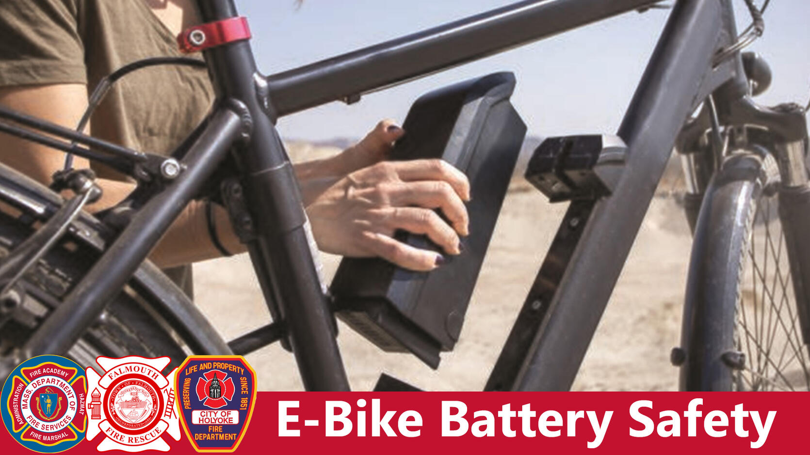 Cyclist placing a battery in an e-bike with the words "e-bike battery safety"