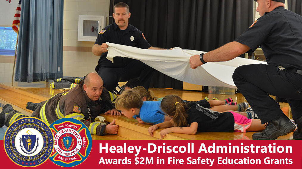 Firefighters teaching children about fire safety