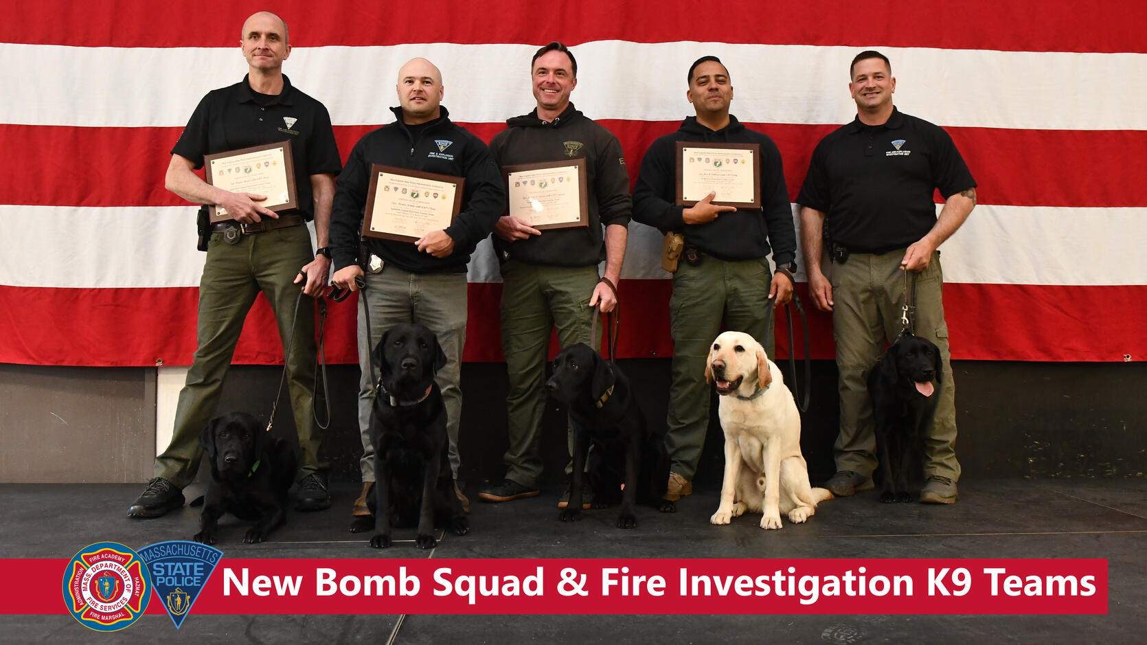 Five fire investigators and Bomb Squad members with their dogs