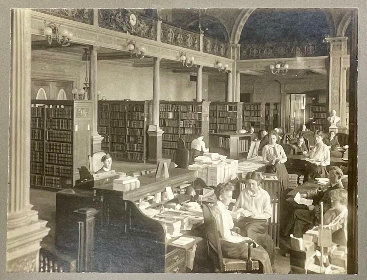 Librarians and patrons in the State Library's main reading room, 1912.