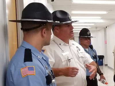 Department of Correction Captain speaking with correction officer