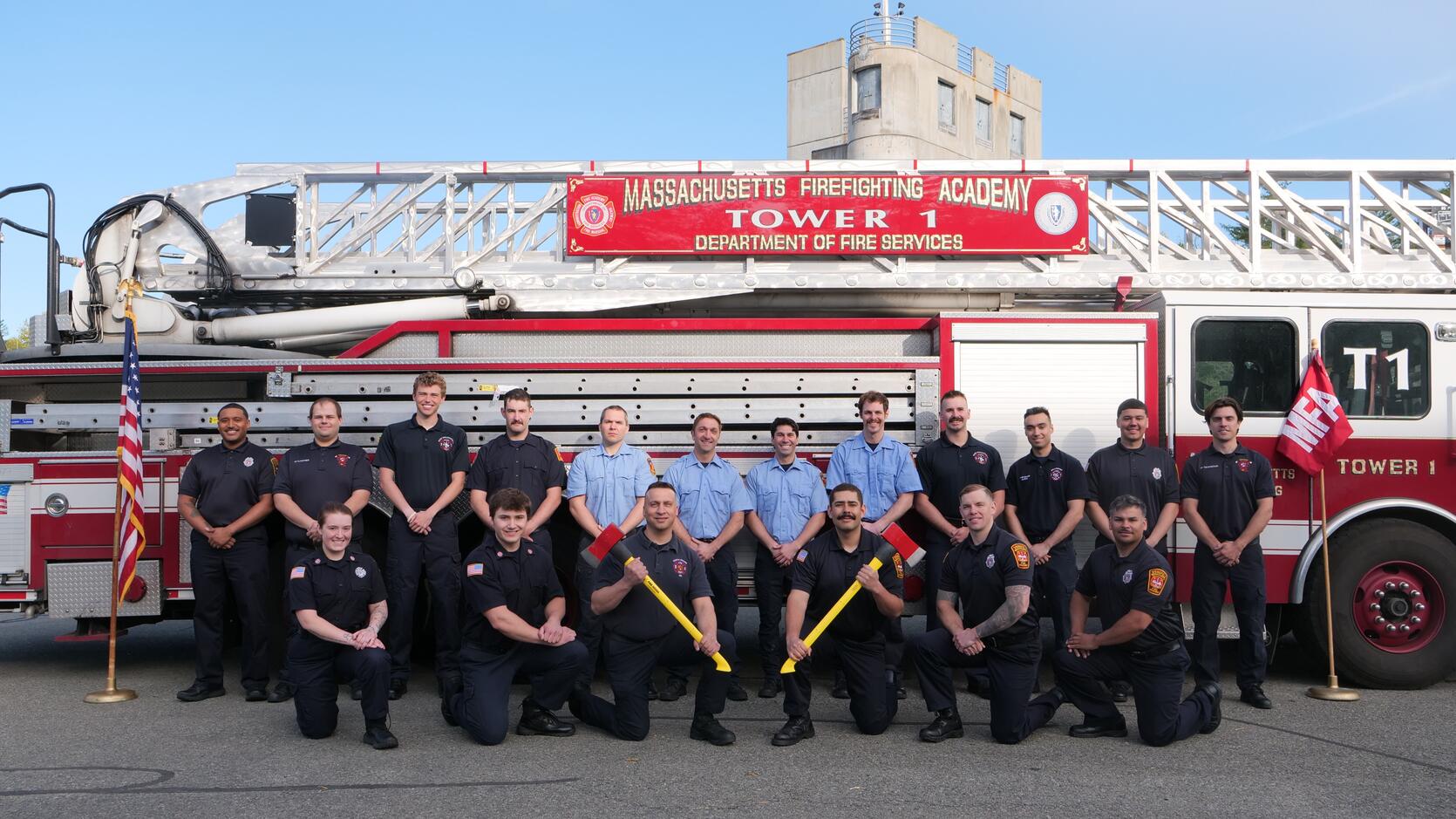 firefighters on and around a ladder truck