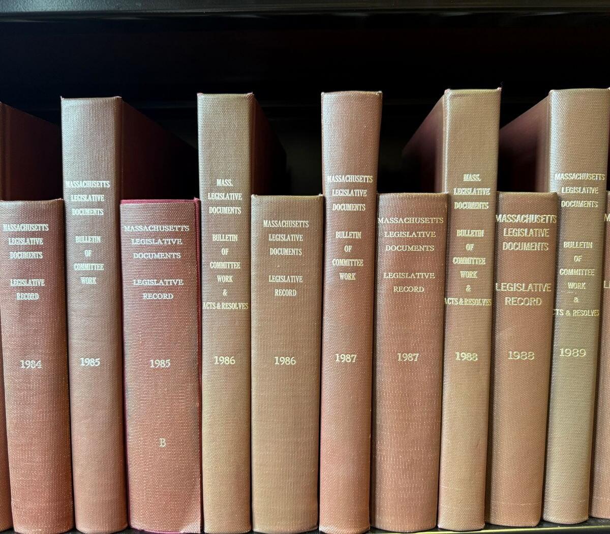 Bookshelf displaying volumes of Massachusetts Legislative Documents