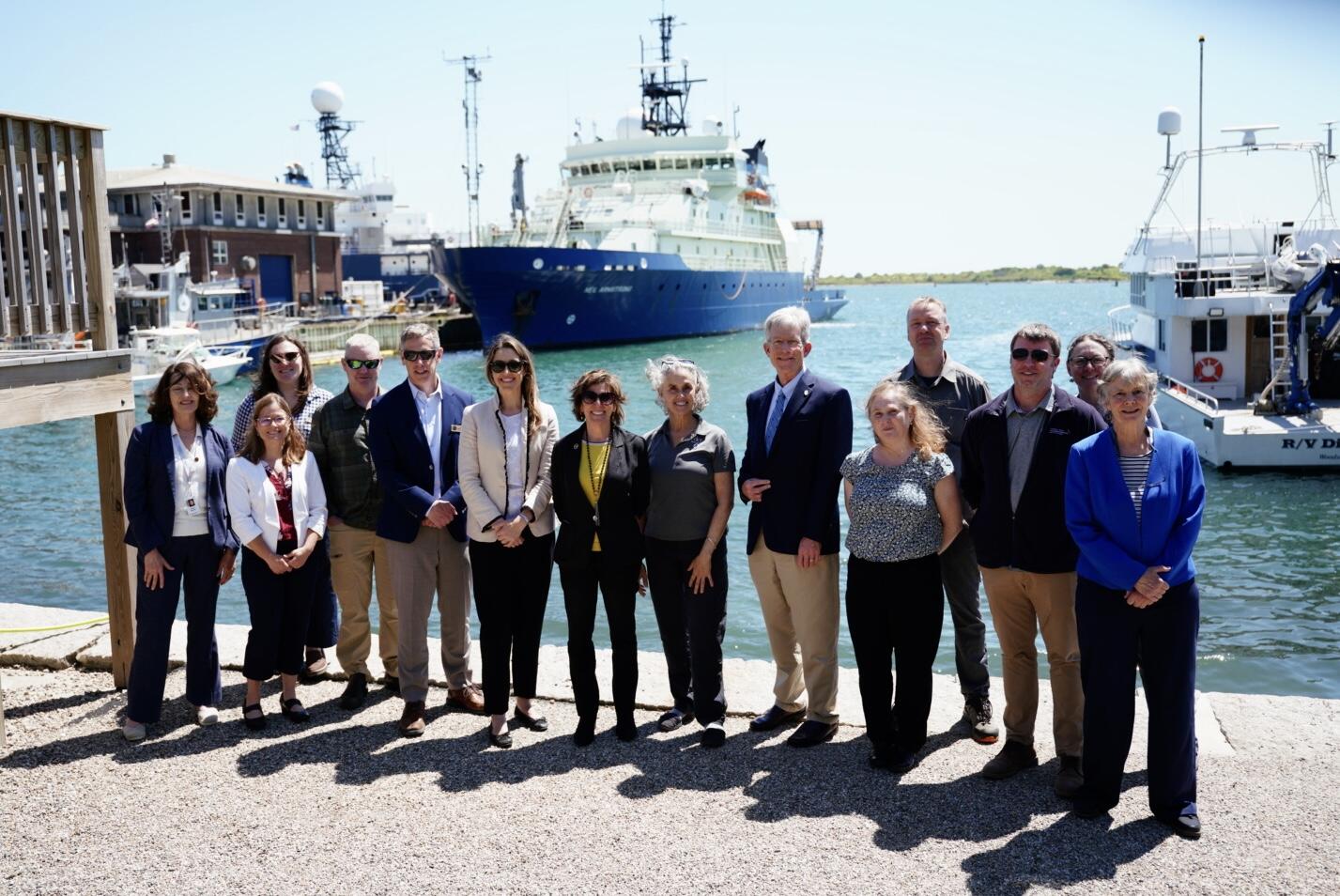 groups photo in Woods Hole in front of the coast where eelgrass lives