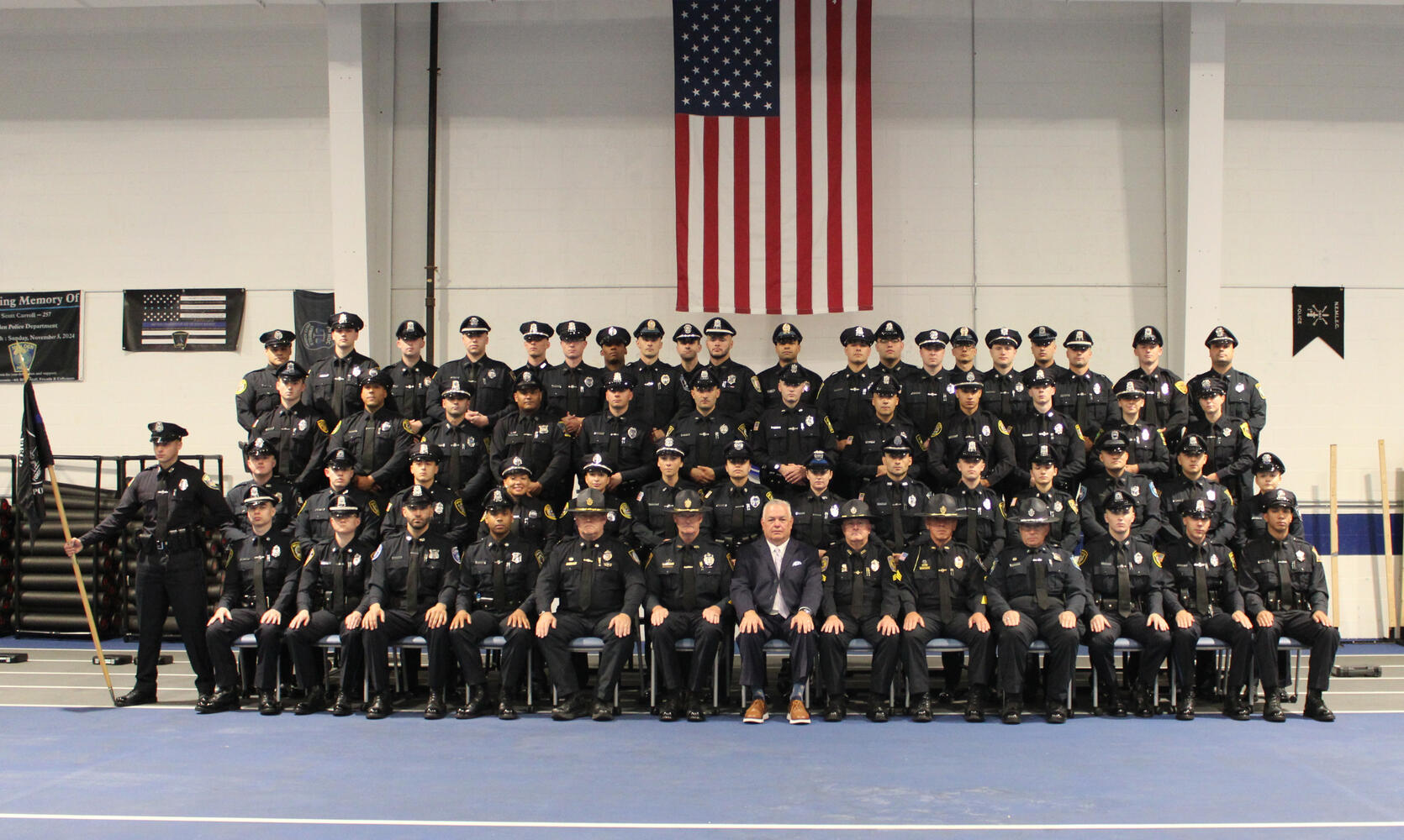 Police Officers pose for a graduation photo