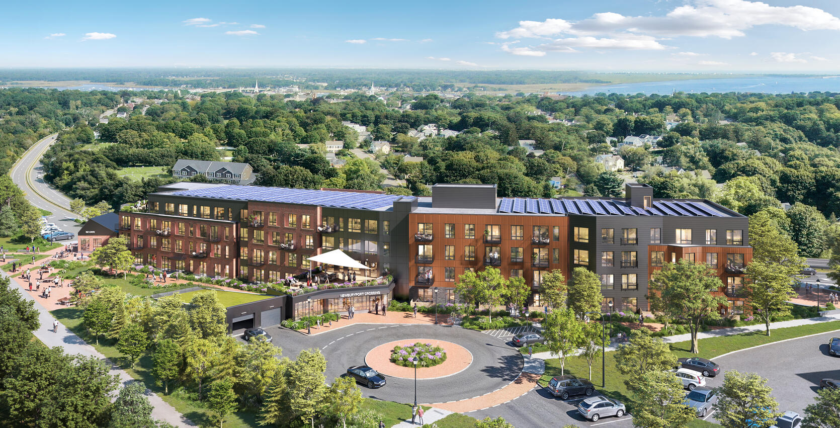 An artistic rendering of Newburyport Crossing showing a four story building in shades of brown with a skyline and the ocean in the background 