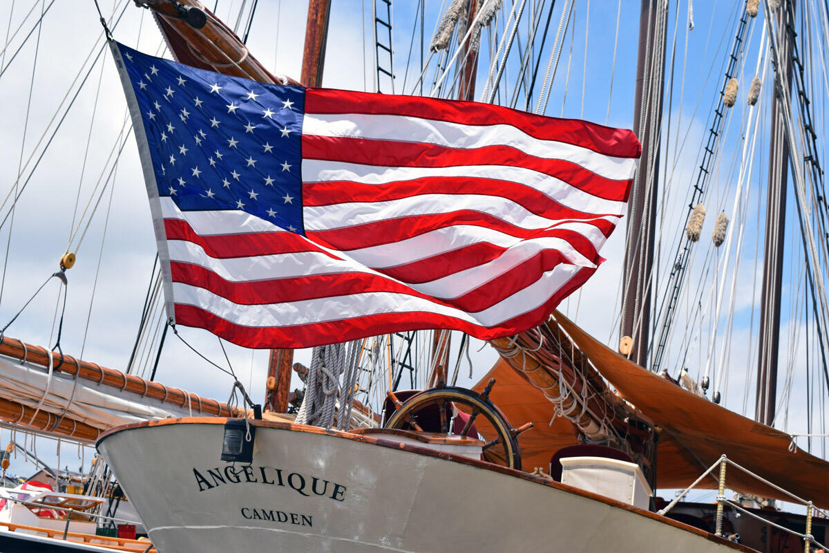 American flag waving on a sail boat