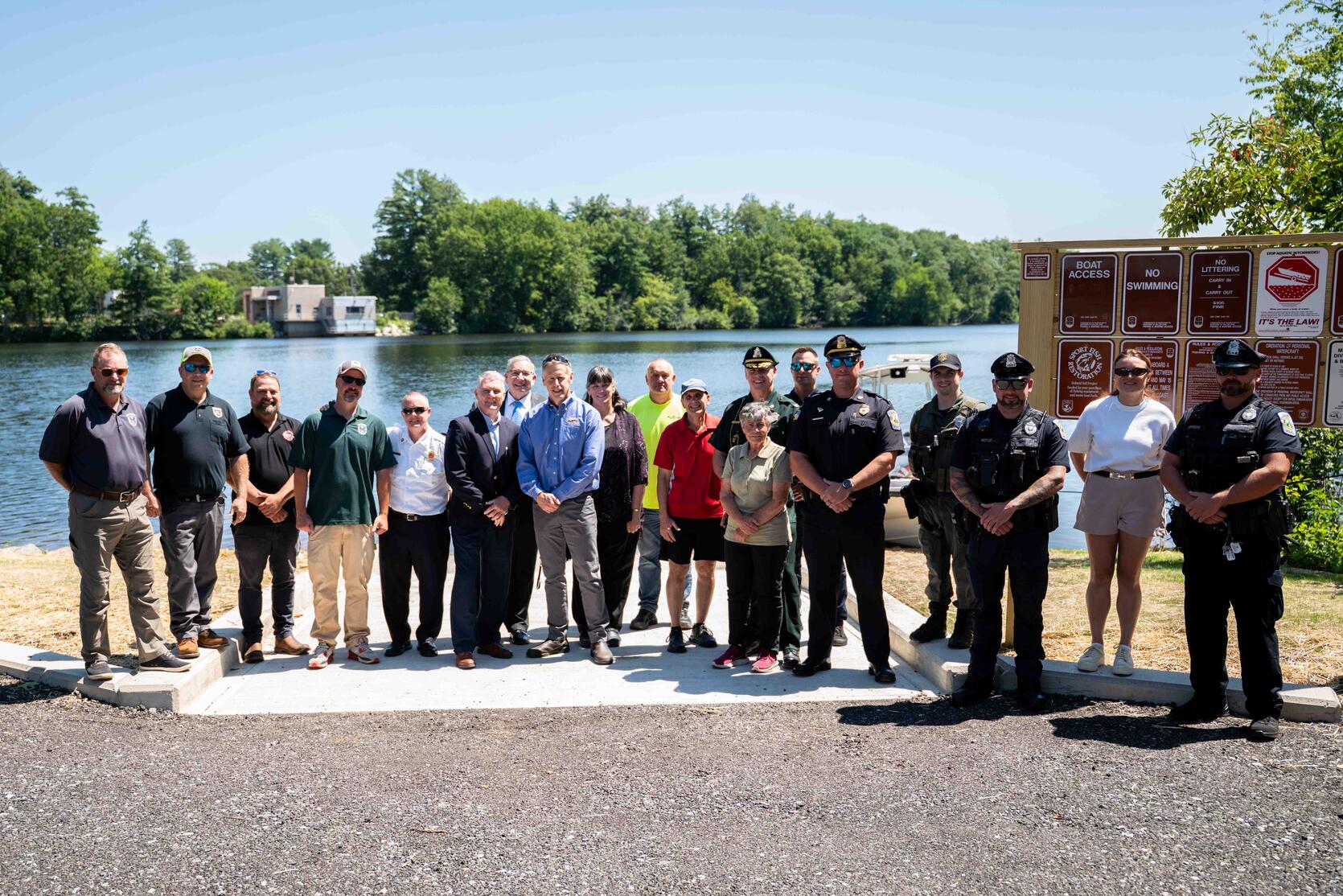 A group of people gather to celebrate the new boat ramp in Chelmsford. 