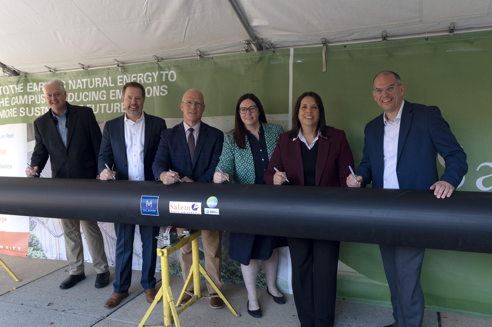 Solect Energy Senior Vice President Matt Shortsleeve, Gilbane Building Company Vice President Justin MacEachern, SSU President John Keenan, DOER Commissioner Elizabeth Mahony, Lieutenant Governor Kim Driscoll, and DCAMM Commissioner Adam Baacke