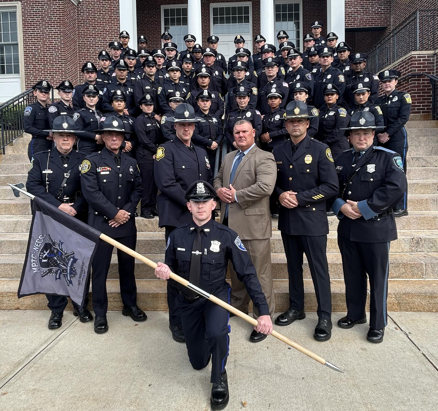 Police Officers pose for a graduation photo