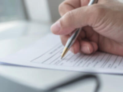 Person filling out a form
