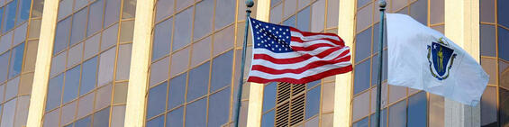 American flag next to the state flag of Massachusetts