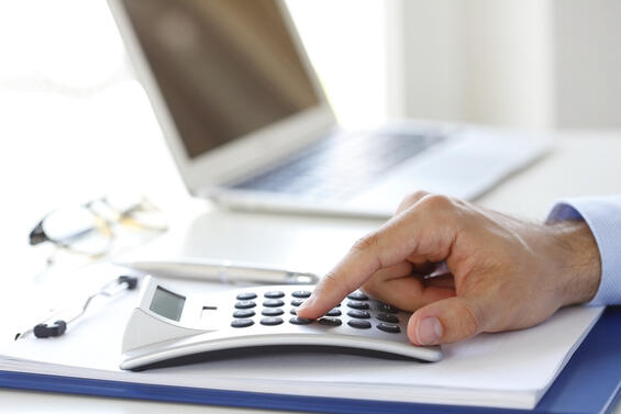 Image of employer doing payroll