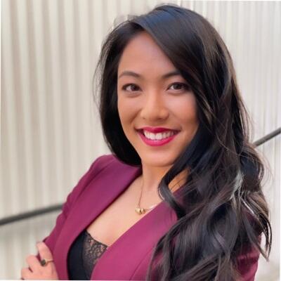 an asian woman in a purple suit