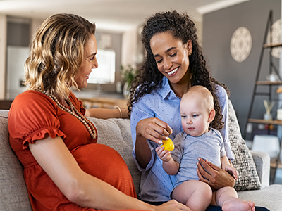 two women and baby