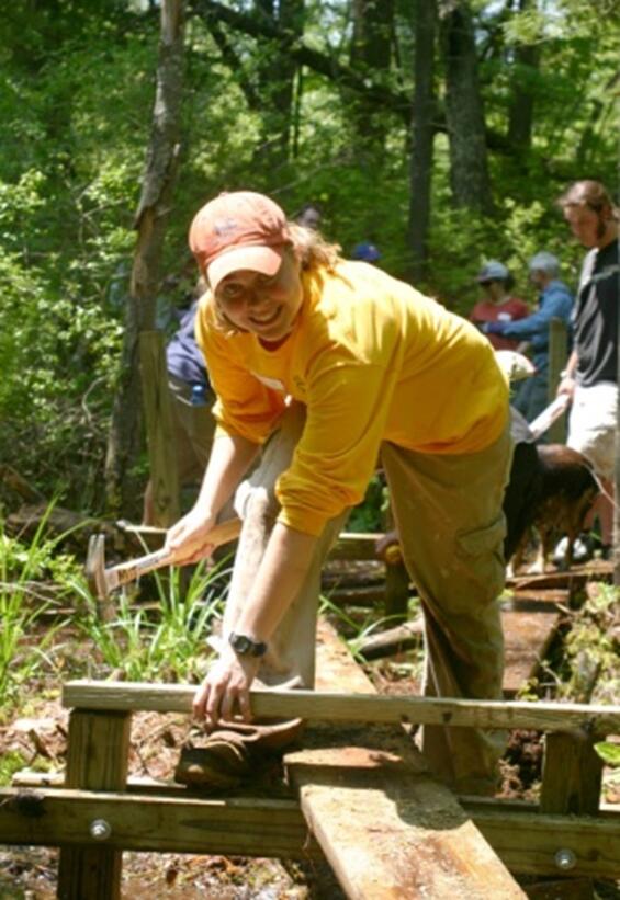 Person hitting a nail with a hammer.