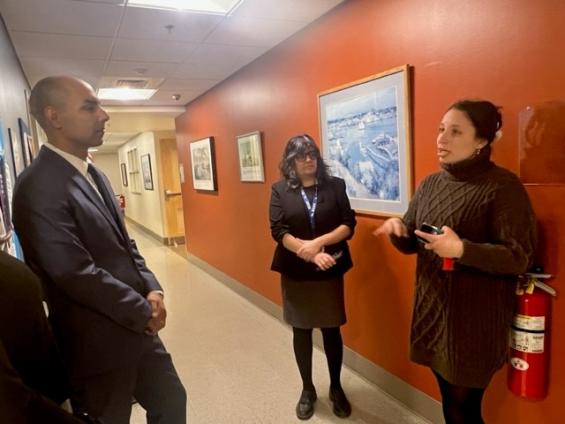 EOVS Secretary Jon Santiago speaks with staff during a visit to the New England Center and Home for Veterans (NECHV).